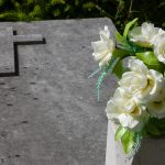 Grave,With,Cross,And,Flowers,In,Vase,At,Old,Cemetery